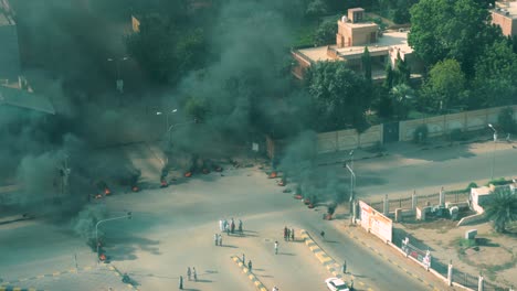 In-the-early-morning-hours-and-just-after-a-military-coup-in-Khartoum,-Sudan-civilian-activists-burn-tires-and-set-up-roadblocks-in-protest