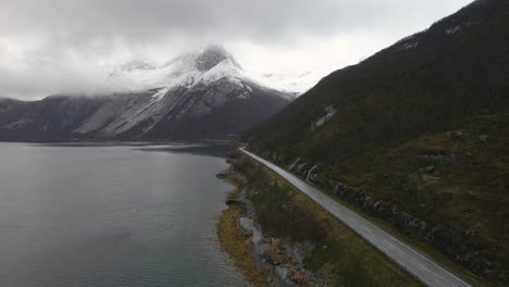 A-car-drives-on-a-Scandinavian-mountain-road-in-winter