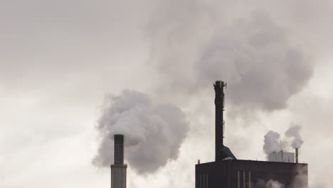Factory-chimneys-with-copy-space-billowing-out-smoke