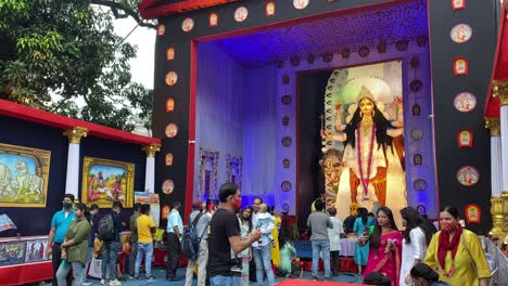 Chandannagar,-West-Bengal---People-gathered-to-watch-beautiful-pandals-of-Hindu-Gods-and-Goddesses-made-from-recyclable-pet-plastic-bottles,-on-display-at-Jagadhatri-Puja-celebrations