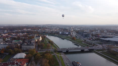 Hot-Air-Balloon-Flying-Over-Vistula-River-And-Krakow-City-In-Poland