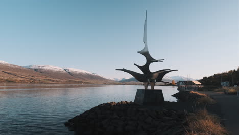 Abstract-statue-of-ship-overlooking-fjord-in-downtown-Akureyri,-Iceland