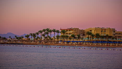 Colorful-sunrise-over-the-Red-Sea's-Beach-Albatros-Resort-in-Hurghada,-Egypt