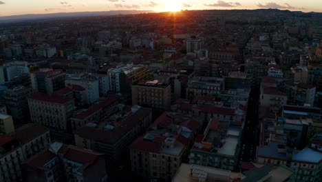 Aerial-View-Over-Catania-Municipality-With-Orange-Sunset-On-Horizon