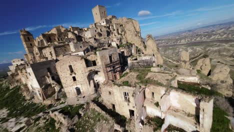 Overflight-over-the-ghost-town-of-Craco-in-Basilicata-province,-Italy
