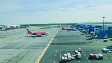 An-aerial-view-of-an-Air-Asia-flight-parking-at-Kuala-Lumpur-International-Airport-in-Malaysia