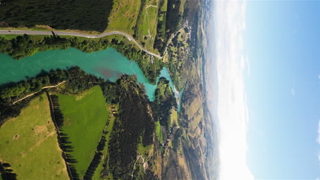 Turquoise-water-in-Clutha-River,-New-Zealand,-aerial-vertical-shot