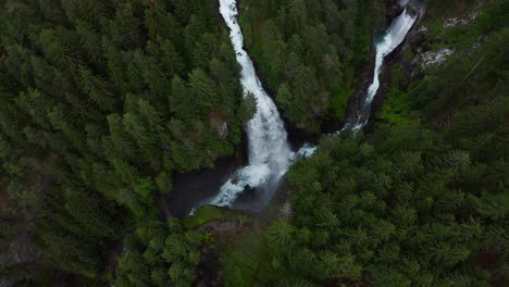 Aerial-top-down-orbit-of-rushing-waterfall-in-Italy