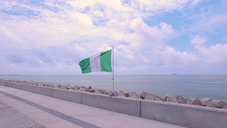 Victoria-Island,-Lagos,-Nigeria--October-1st,-2022:-Nigeria's-flag-blowing-in-the-wind-on-independence-day