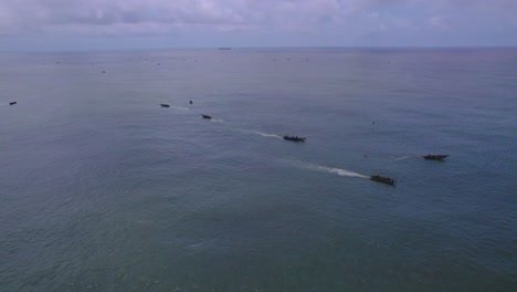 Victoria-Island-Lagos,-Nigeria---20-November-2022:-Drone-view-of-a-fisherman-on-a-fishing-boat-on-the-coastline-of-Lagos