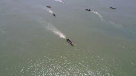 Victoria-Island-Lagos,-Nigeria---20-November-2022:-Drone-view-of-a-fisherman-on-a-fishing-boat-on-the-coastline-of-Lagos