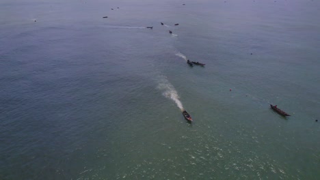 Victoria-Island-Lagos,-Nigeria---20-November-2022:-Drone-view-of-a-fisherman-on-a-fishing-boat-on-the-coastline-of-Lagos