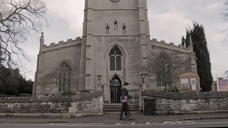 Oakham-School-student,-both-girl-and-boy-walking-past-St