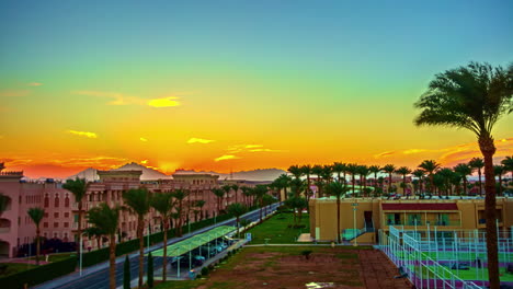Sunset-over-a-resort-and-sports-complex-area-of-Hurghada,-Egypt---time-lapse