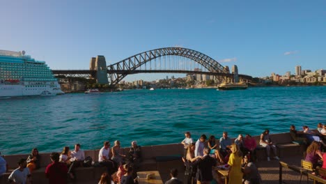 Tourists-and-big-cruiser-at-Sydney-Opera-House-at-circular-quay-in-Sydney-CBD