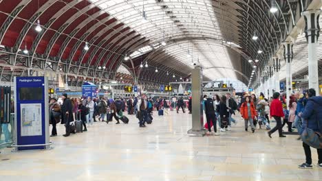 People-wandering-around-and-using-public-transport-to-travel-on-New-Years-Eve-in-London-Paddington-Railway-and-Underground-Station