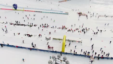 Aerial-rise-tilt-down-shot-of-cross-country-skiers-getting-ready-for-race