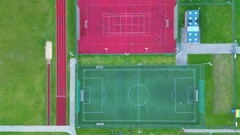 Recreational-green-grass-active-sports-hockey-and-football-fields-overhead-top-down-view