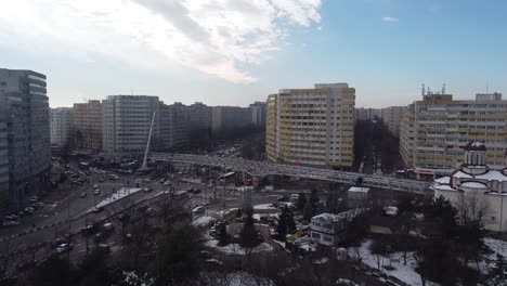 Aerial-Of-Bridge-Construction-Over-A-Cross-Junction-At-Rush-Hour