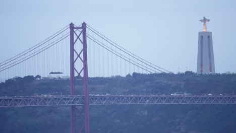 Lisbon-city-before-sunrise-with-April-25-bridge-night-to-day-transition-timelapse,-Cristo-Rei-and-lighthouse-early-morning
