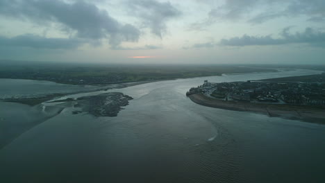 River-mouth-at-dawn-in-winter-with-pan-across-to-port-of-Fleetwood-from-Knott-End