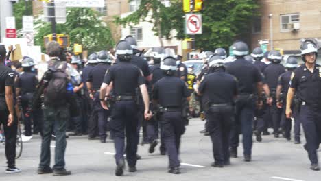 Groups-of-NYPD-Officers-in-Riot-Gear-approaching-Black-Lives-Matter-protestors-in-Brooklyn,-New-York-City