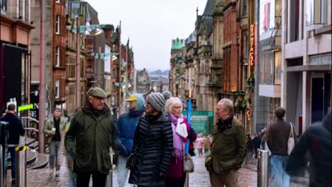 Timelapse-of-Buchanan-Street-during-the-day-with-people-waiting-and-crossing-the-road,-Glasgow-city-centre,-Scotland