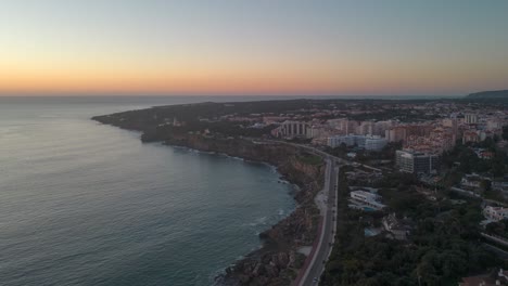 Timelapse-of-sunset-over-a-small-town-in-middle-eastern-city-in-summer-with-some-waves-moving