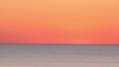Bokeh-view-of-sunset-seascape-with-orange-sky