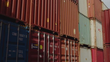 Tilt-down-shot-of-many-colorful-stacked-container-shipping-container-in-Port-of-Le-Havre,-France