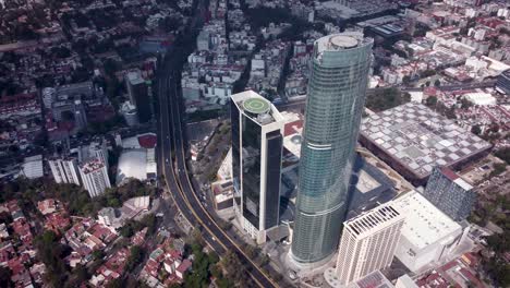 Orbital-drone-view-of-emblematic-skyscraper-in-the-south-of-Mexico-City-located-on-Rio-Churubusco-Avenue