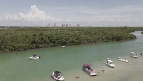 Boat-traffic-along-Bay's-Island-toward-Estero-Bay-at-Bonita-Beach,-FLA