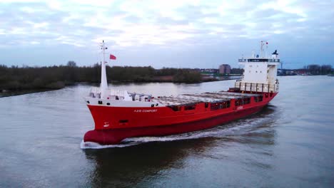 Aerial-Port-Side-View-Of-A2B-Comfort-Cargo-Ship-Travelling-Along-Oude-Maas-Near-Zwijndrecht