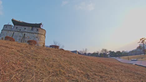Asian-Korean-Hwaseong-fortress-rock-stone-wall-in-Suwon,-traditional-culture-architecture-object-UNESCO-heritage-panoramic-view