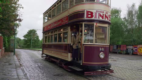 Vintage-electrified-tram-and-female-conductor-at-Beamish-open-air-museum