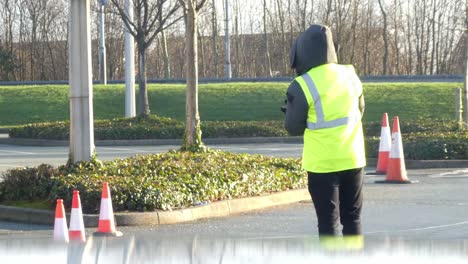 Covid-medical-staff-technician-working-on-test-centre-car-park-during-healthcare-crisis