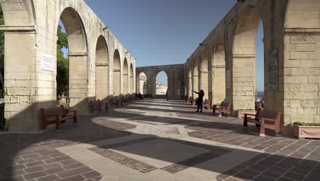 Upper-Barrakka-Gardens-Terrace-in-Valletta-on-a-Sunny-Day-with-People-Walking-Around