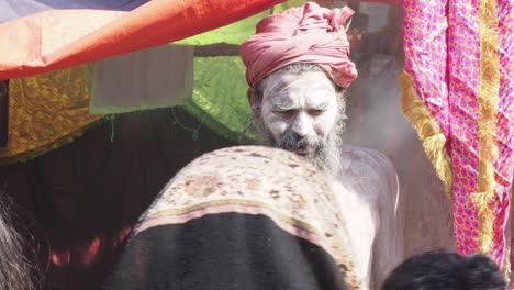 Naga-sadhu-at-ganga-Sagar-transit-camp-Kolkata-west-Bengal-India-giving-blessings-to-followers