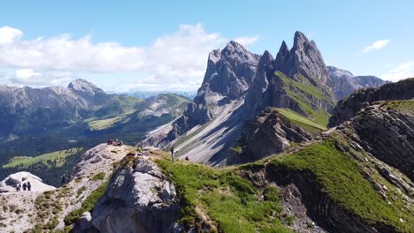 Seceda-at-Urtijëi,-South-Tyrol,-Italian-Alps,-Dolomites,-Italy---Aerial-Drone-View-of-tourists-and-Mountain-Peak