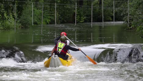 Two-people-fall-off-inflatable-canoe-kayak-on-whitewater-rapid-river