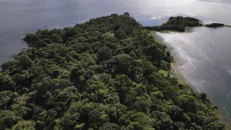 Aerial-footage-of-a-small-peninsula-at-lake-Arenal-in-central-Costa-Rica-during-green-season
