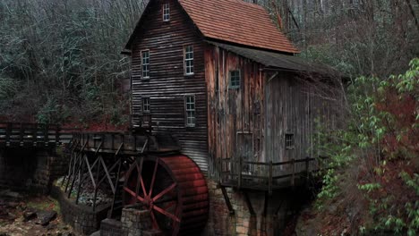 Glade-Creek-Grist-Mill-in-West-Virginia-with-bridge-and-drone-video-moving-up-close