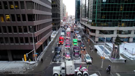 Long-Drone-Shot-of-Freedom-Trucker-Rally-over-Kent-Street-in-Ottawa,-ON-Jan-30,-2022,-during-the-Covid-19-Pandemic