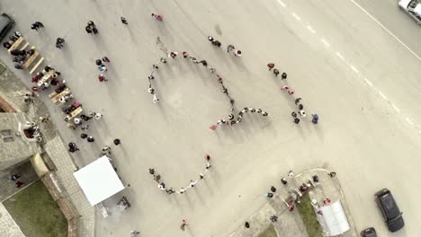 Drone-shot-over-celebrating-crowd-of-Bulgarians-dancing-traditional-horo