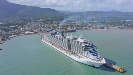 Aerial-View-of-MSC-Seashore-Cruise-Ship-First-to-Dock-at-New-Taino-Bay-Port,-Puerto-Plata,-Dominican-Republic