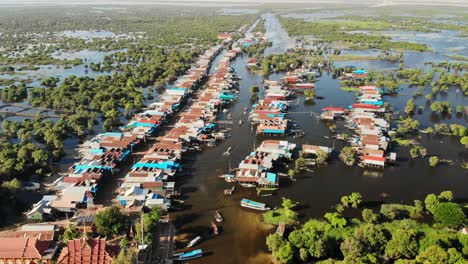 Tonle-Sap-floating-village-aerial-drone-view,-famous-touristic-place-in-Cambodia