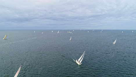 Aerial-flyover-ocean-with-cruising-Sailing-Boats-during-Regatta-Championship-Race