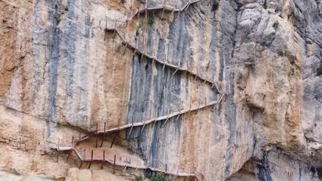 Pasarelas-de-Montfalco-at-Congost-de-Mont-Rebei-Canyon,-Catalonia-and-Aragon,-North-Spain---Aerial-Drone-View-of-the-Dangerous-Scary-Stairs-and-Hiking-Trail-along-the-Steep-Cliffs