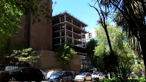 A-shot-of-the-facade-of-a-new-urban-development-currently-being-constructed,-the-building-site-is-located-on-a-prime-suburban-street-and-a-great-real-estate-investment-in-Johannesburg,-South-Africa