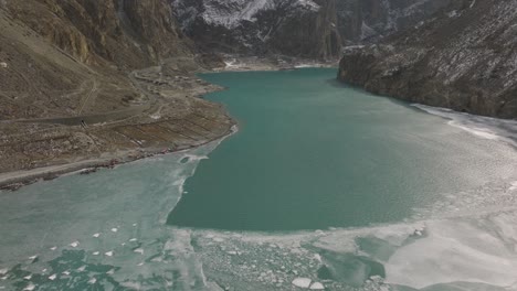 Cinematic-aerial-shot-of-Ice-on-the-surface-of-Attabad-Lake-,-Hunza-,-Northern-area-of-Pakistan-during-winter